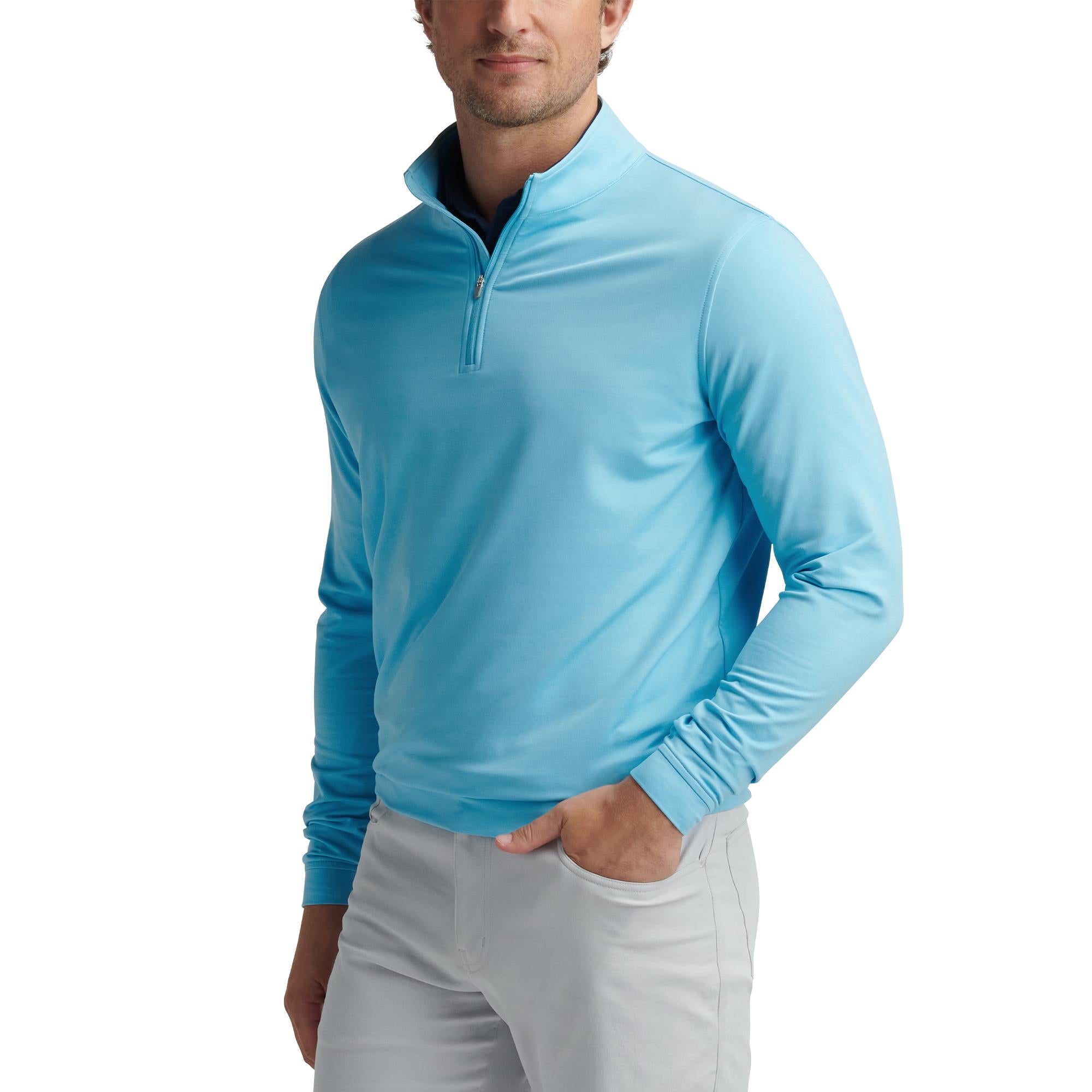 Male model wearing Peter Millar Perth Mélange 1/4 Zip in Maya Blue – premium mens golf mid layer and layering piece